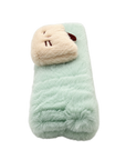 Side view of a soft and fluffy mint green cat spa headband, showing its plush texture and thickness.