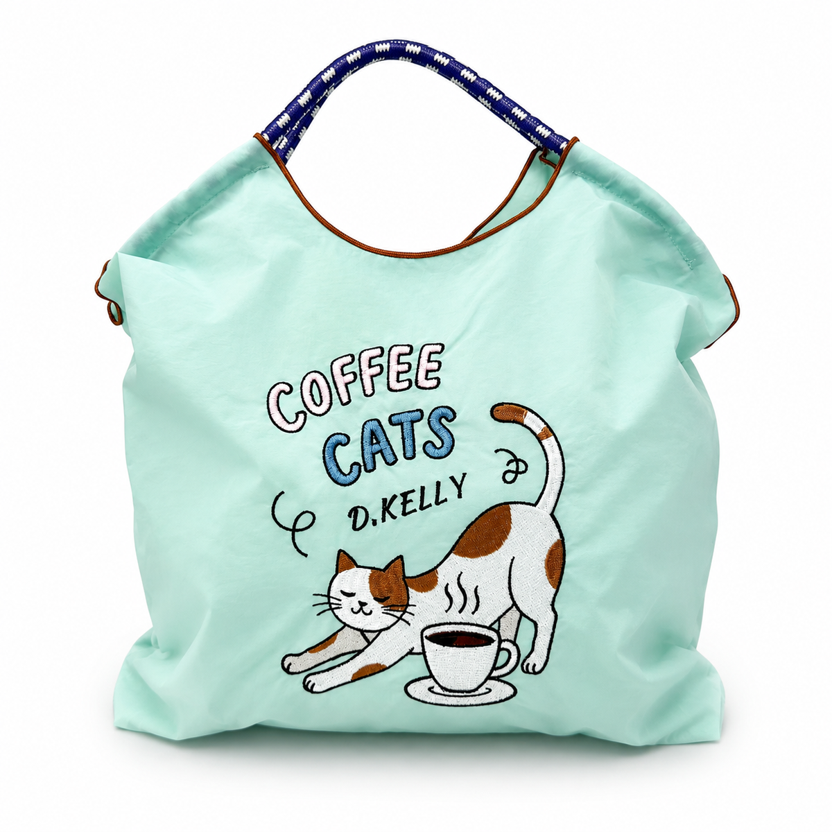 Mint green Coffee Cats tote bag filled with items, showing its roomy shape and embroidered cat and coffee cup design.