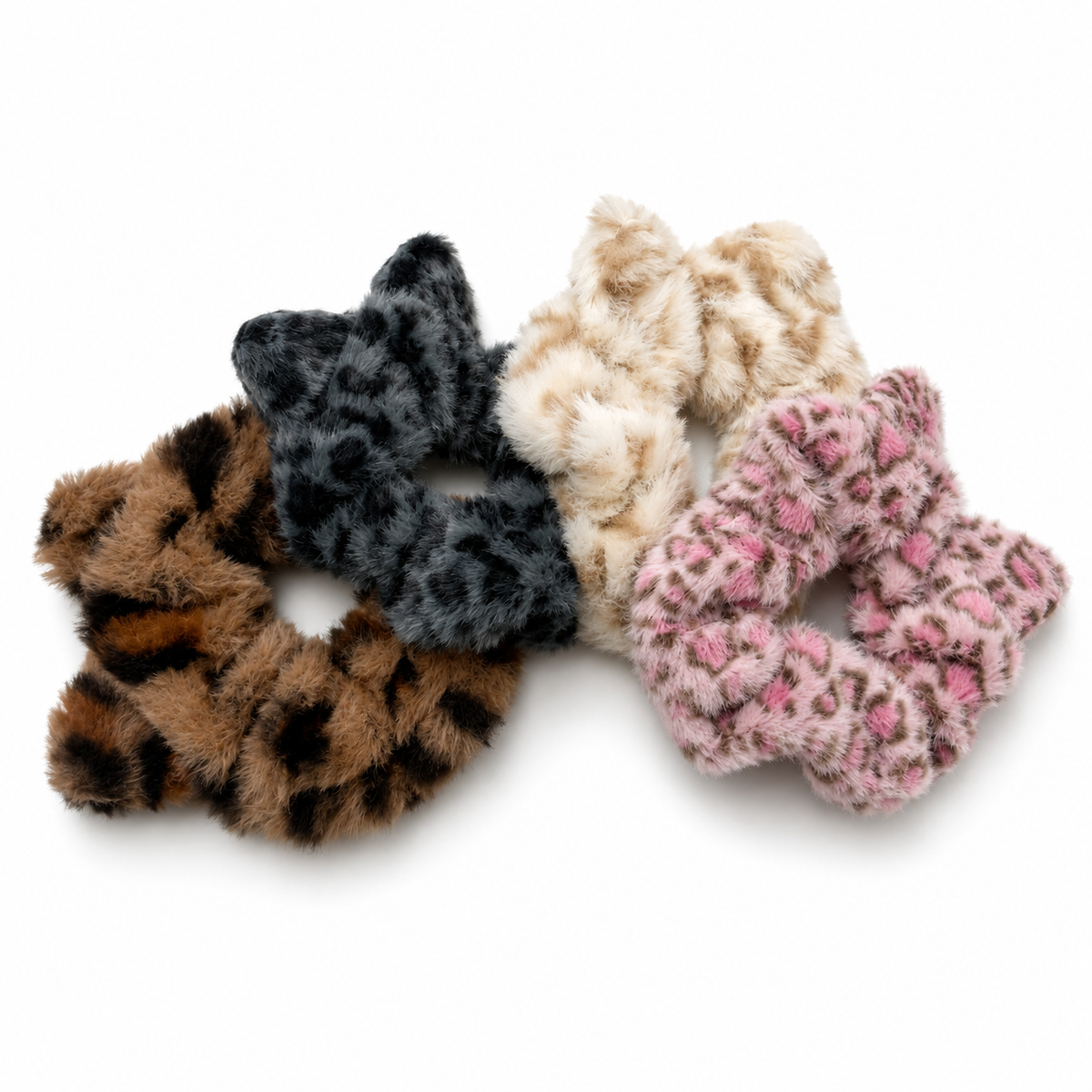 Four soft, fluffy cat ear scrunchies in brown leopard, gray and black leopard, cream leopard, and pink leopard designs.
