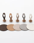 Five color variations of mallets and mats for Tailo pet memorial bell: Chocolate, Tan, Cream, Mixed Gray, and White