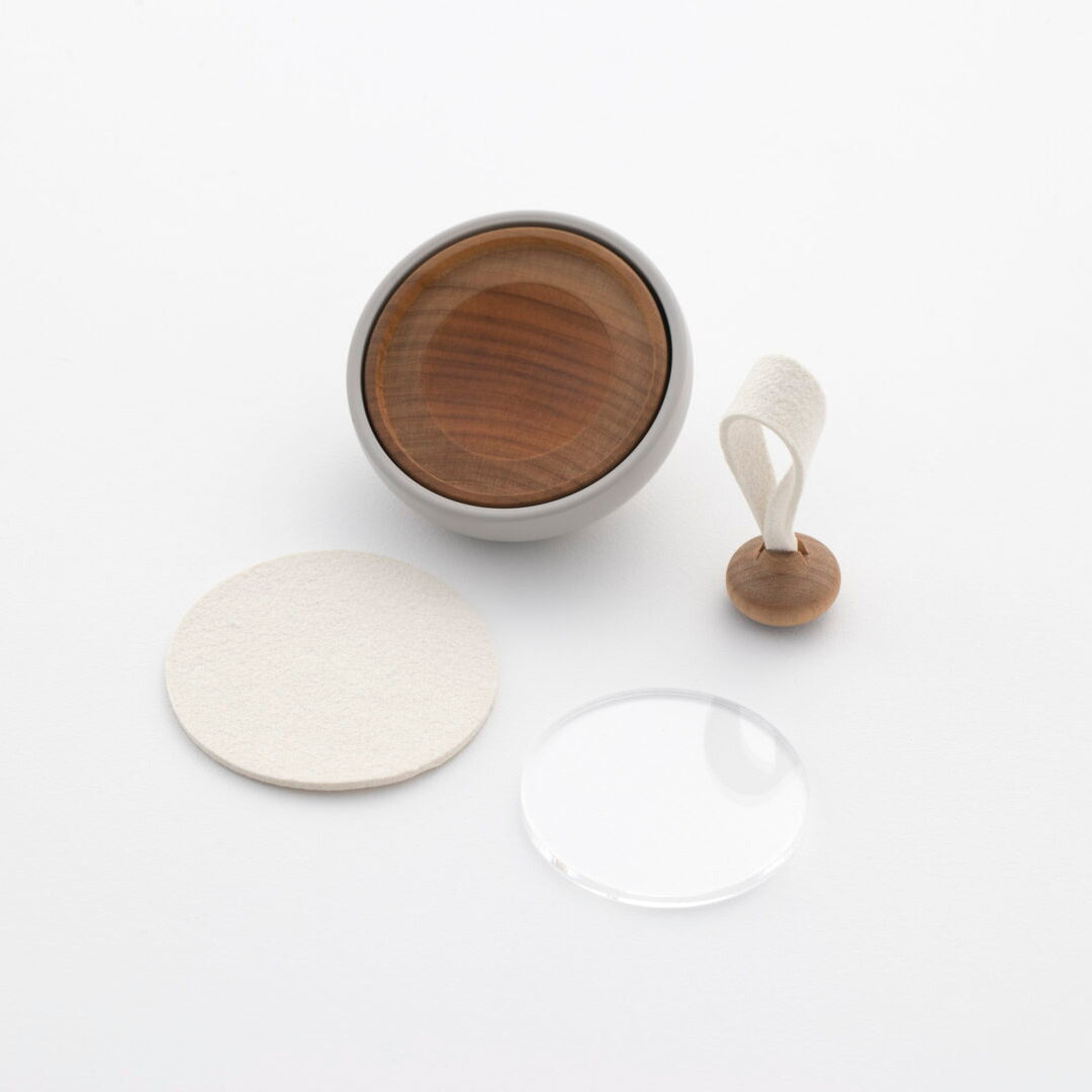 Tailo pet memorial bell with its bell body, round mat, clear acrylic cover, and mallet