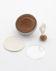 Tailo pet memorial bell with its bell body, round mat, clear acrylic cover, and mallet