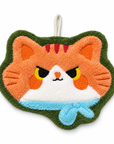 Orange cat-face-shaped hand towel with a light blue scarf around its neck, green trim, and a hanging loop.